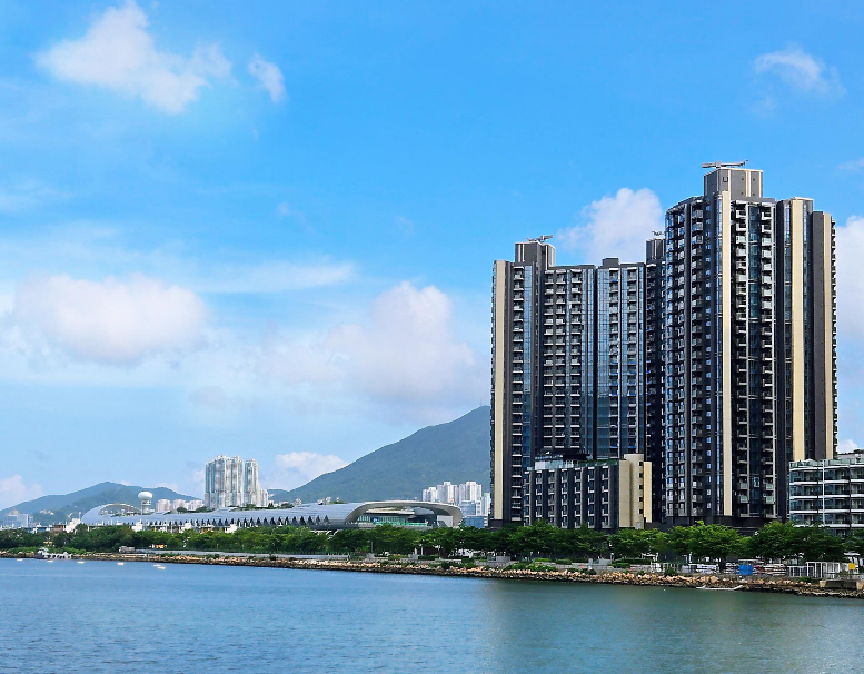 A large building next to a body of water

AI-generated content may be incorrect.