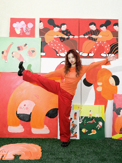 A person standing in front of a wall of paintings

AI-generated content may be incorrect.